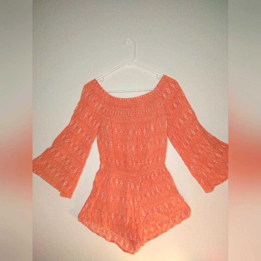 Rip Curl orange and white off the shoulder romper.